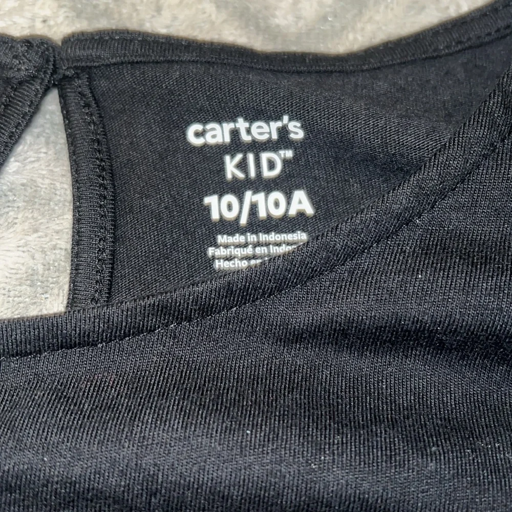 Carter’s Girl’s Black Long Sleeve With a Heart Detail.